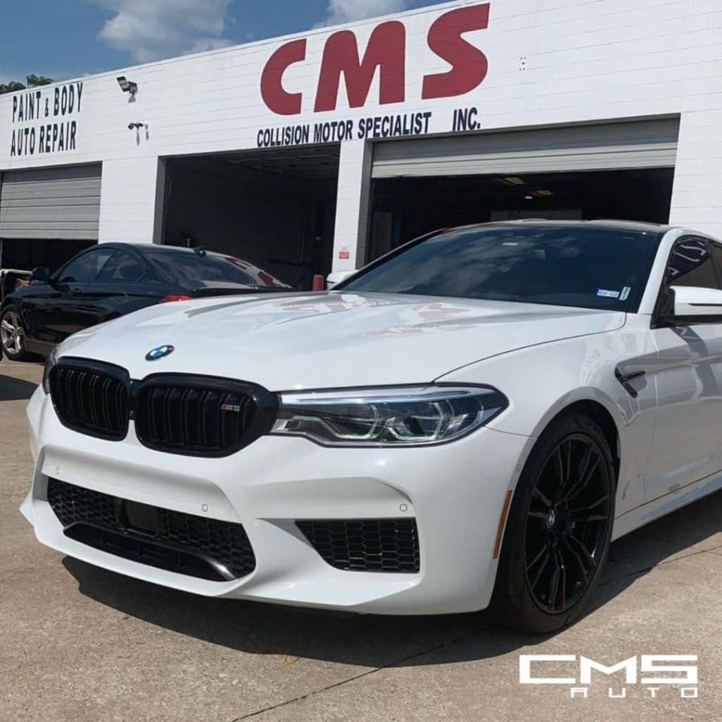 BMW Vehicle parked outside Collision Motor Specialist body shop in Houston