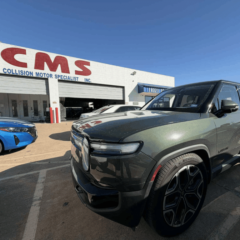 Green Rivian at CMS Auto Body Shop Houston